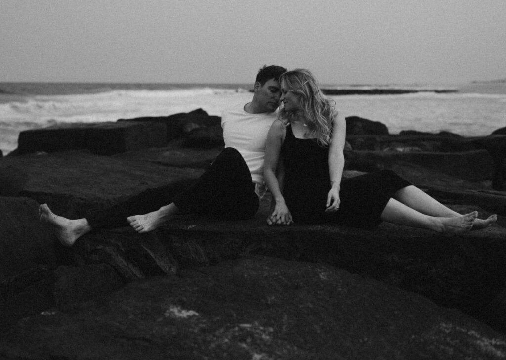 couple sitting on the rocks together